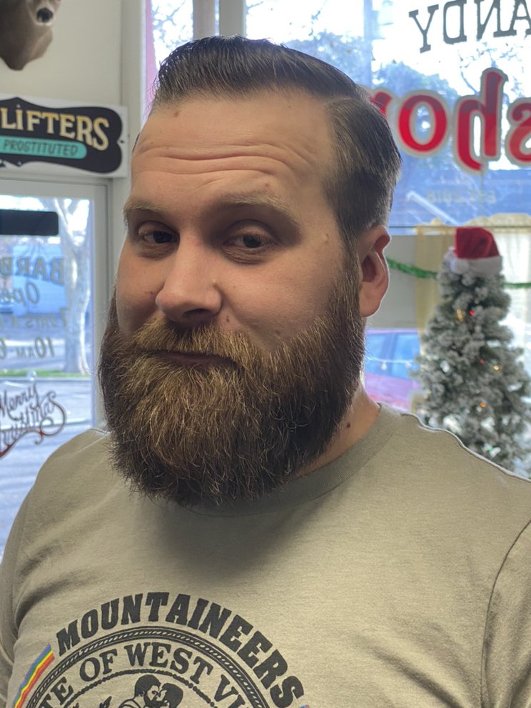 A man with a neatly trimmed beard