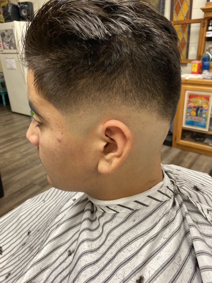 A boy with a fade haircut