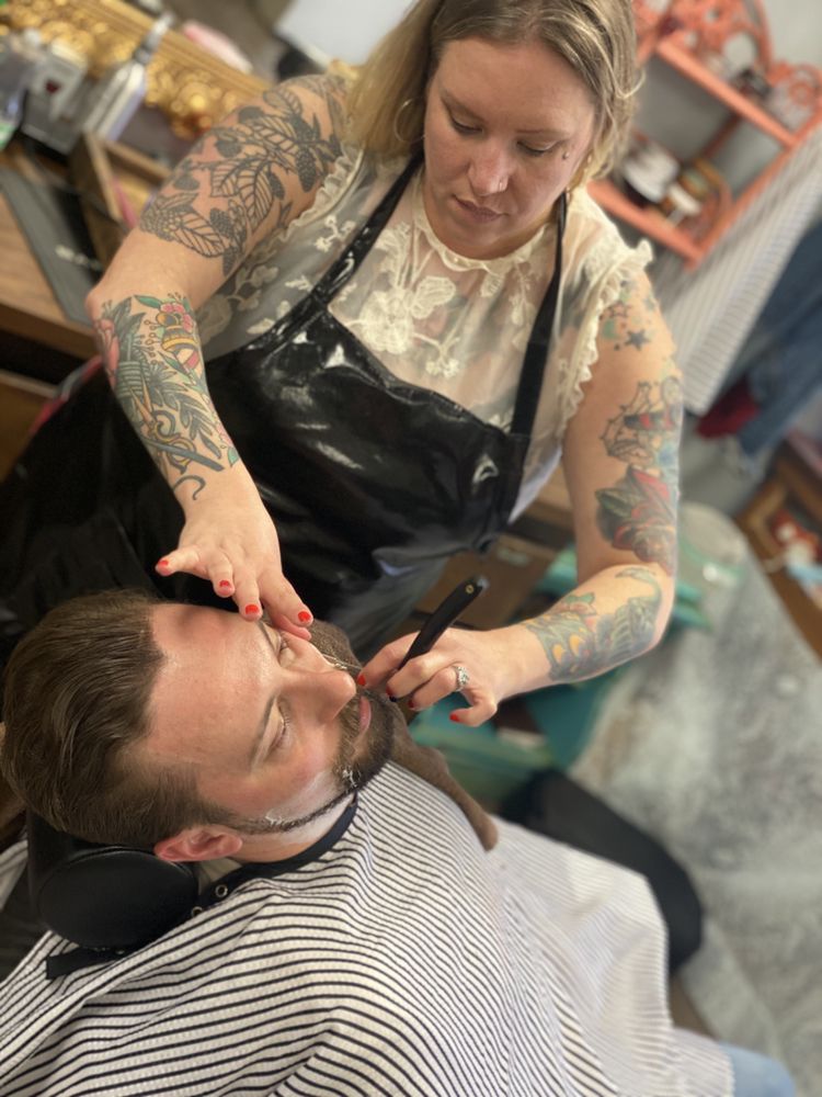 A man receiving a shave